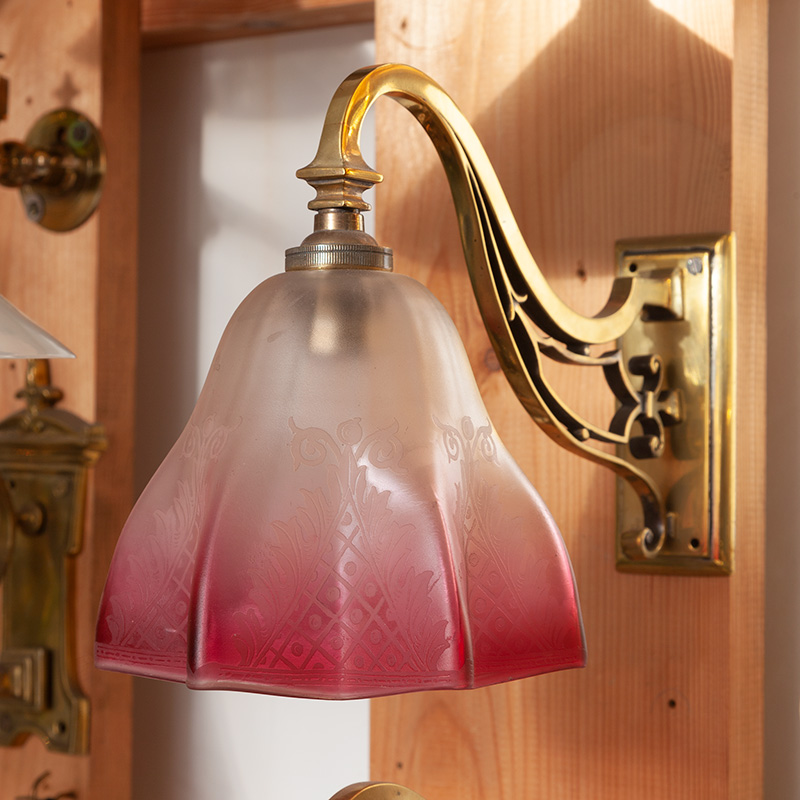 Pair of Edwardian Cast Brass Wall Lights with Graduating Clear and Cranberry Glass Shade